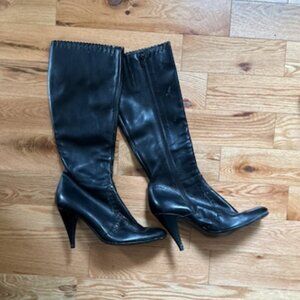 Black leather boots with high heels and western scallop and stitching